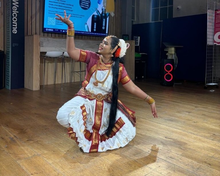 Classical Kuchipudi seated posture with crossed feet and mudra